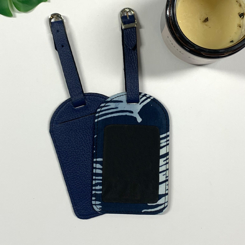 a picture of luggage tag made of batik remnants in the patter navy sawit