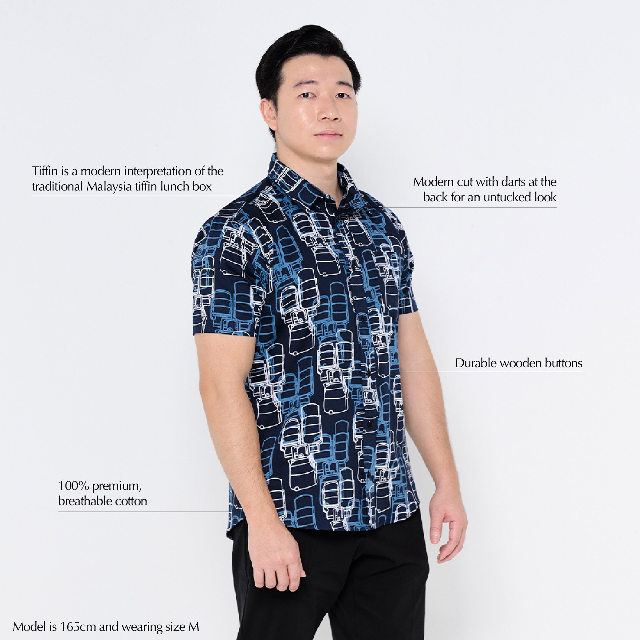 a male model against a white background poses in a batik shirt in the pattern navy tiffin