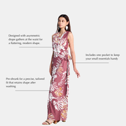 A woman modeling a sleeveless white maxi dress with a light maroon abstract pattern, shown against a light gray background with text callouts describing its features.