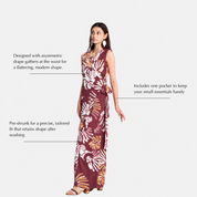 A woman modeling a sleeveless white maxi dress with a light maroon abstract pattern, shown against a light gray background with text callouts describing its features.