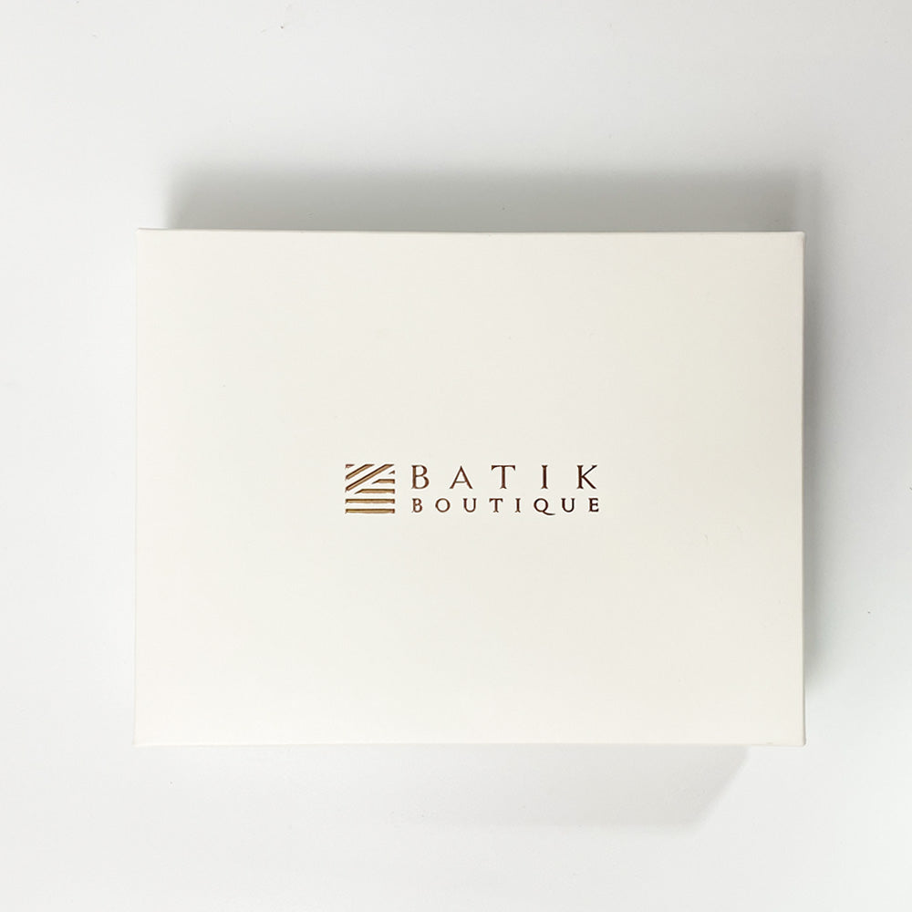 a white box against a neutral background that's perfect for gifting