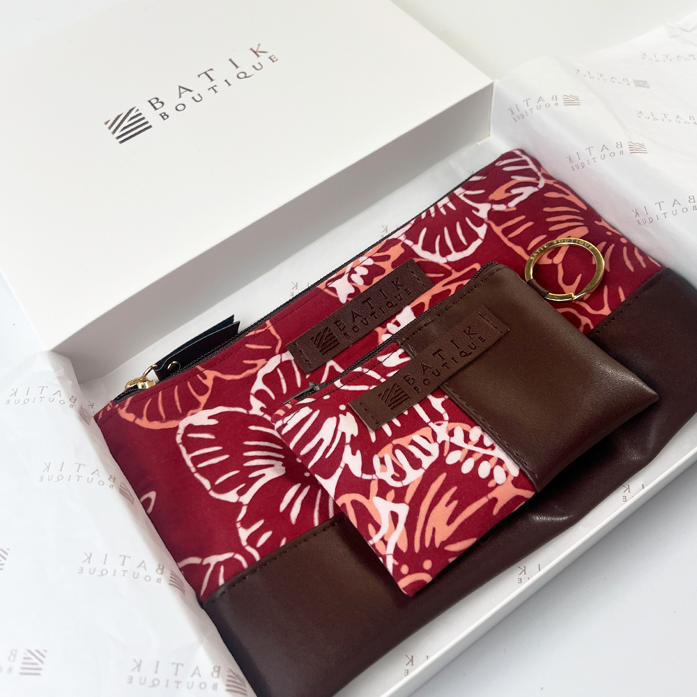Brown wallet with red floral pattern in a box from Batik Boutique