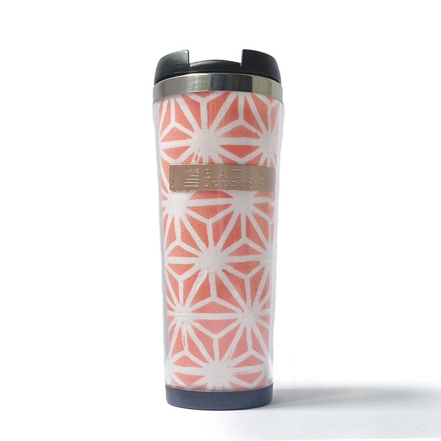 a batik tumbler with the pattern peach firework on a white surface