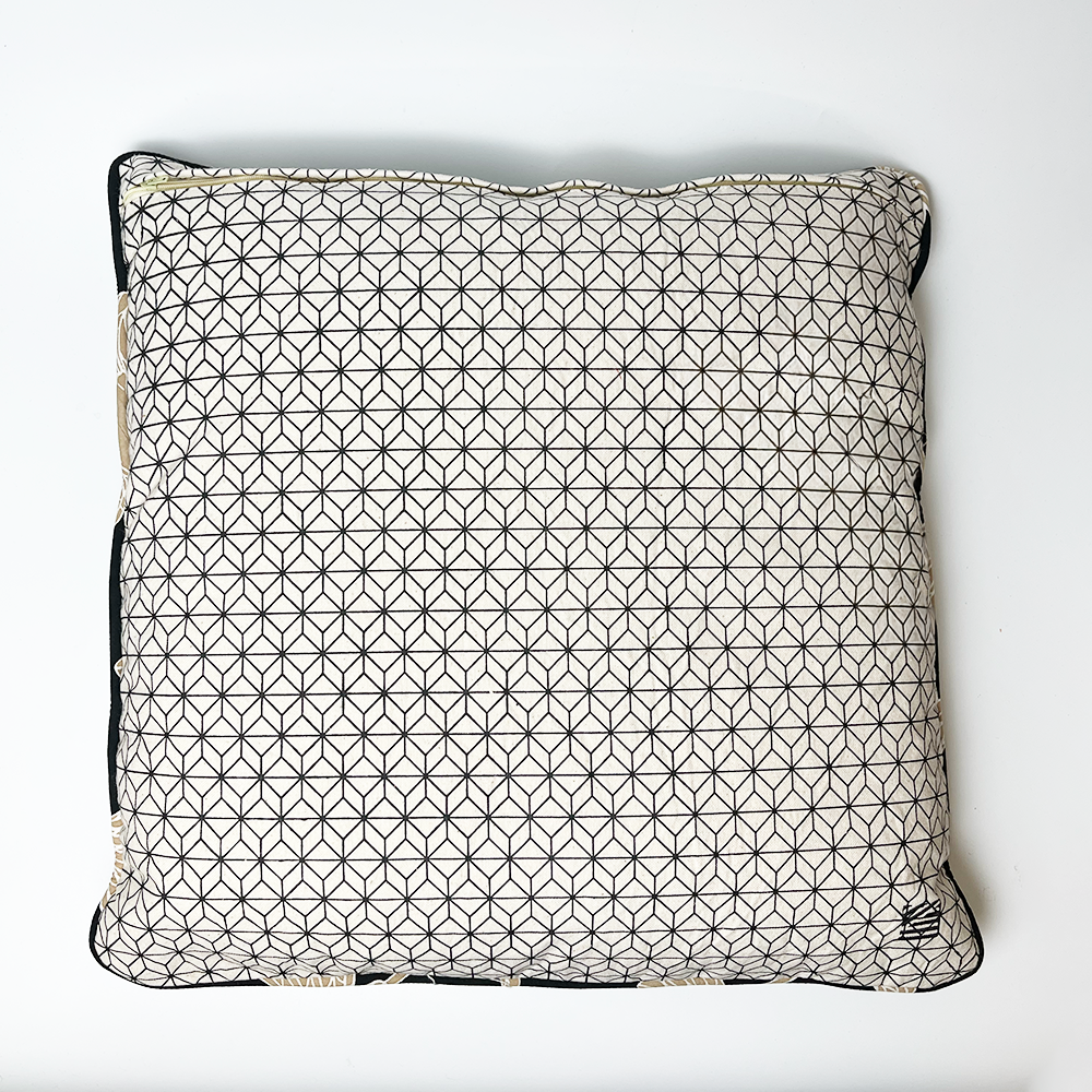 a reversible batik pillow cover against a white background