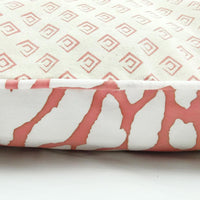 A whitebox photo of reversible pillow cover in coral bunga. Showing side of the pillow cover, showing it can be reversible