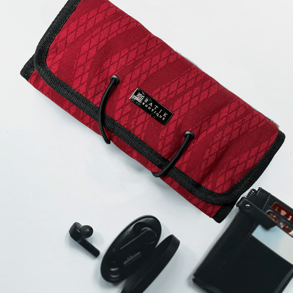 Batik Boutique's Red Snakeskin Travel Roll Up Pouch, a stylish and practical accessory, ideal for organizing your essentials.