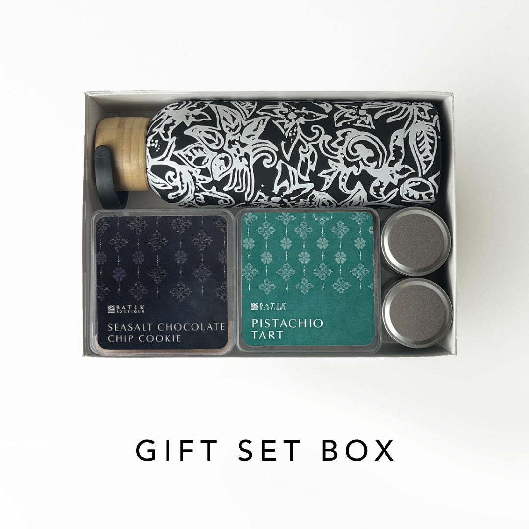 Gift set box with a bottle, cookies, and tarts on a white background