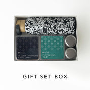 Gift set box with a bottle, cookies, and tarts on a white background