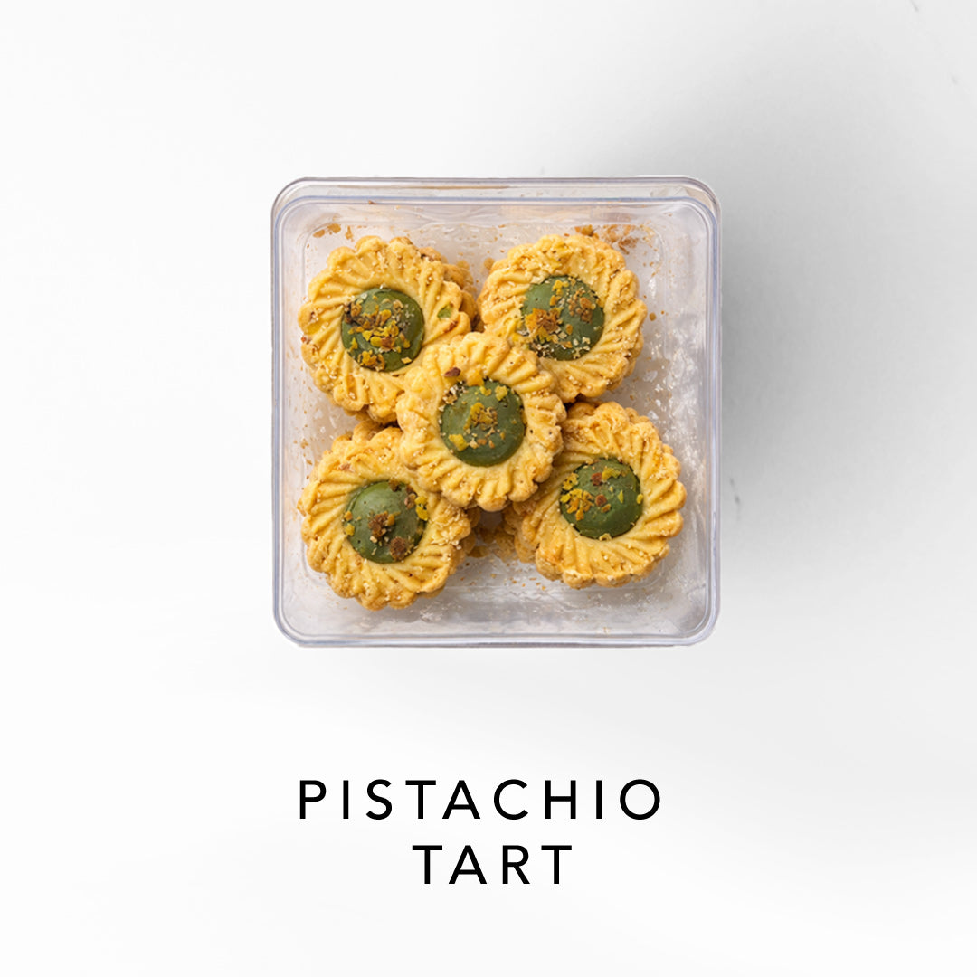 Packaged pistachio tart on a white background 