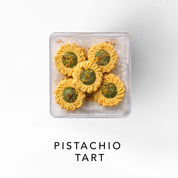 Packaged pistachio tart on a white background 