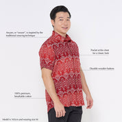 a male model posing in a batik shirt in the pattern red anyam new color