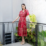 Women wearing red orchid button up dress 