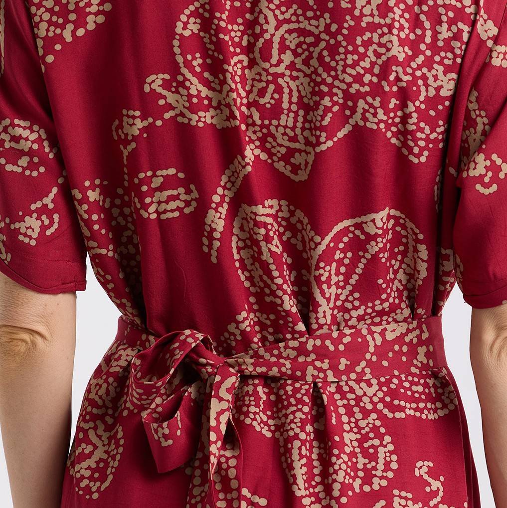 Close up of the red orchid button up dress 