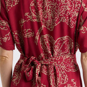 Close up of the red orchid button up dress 