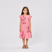 Girl standing in studio shoot with pink dress