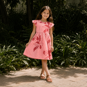 Girl in Pink Dress by grass