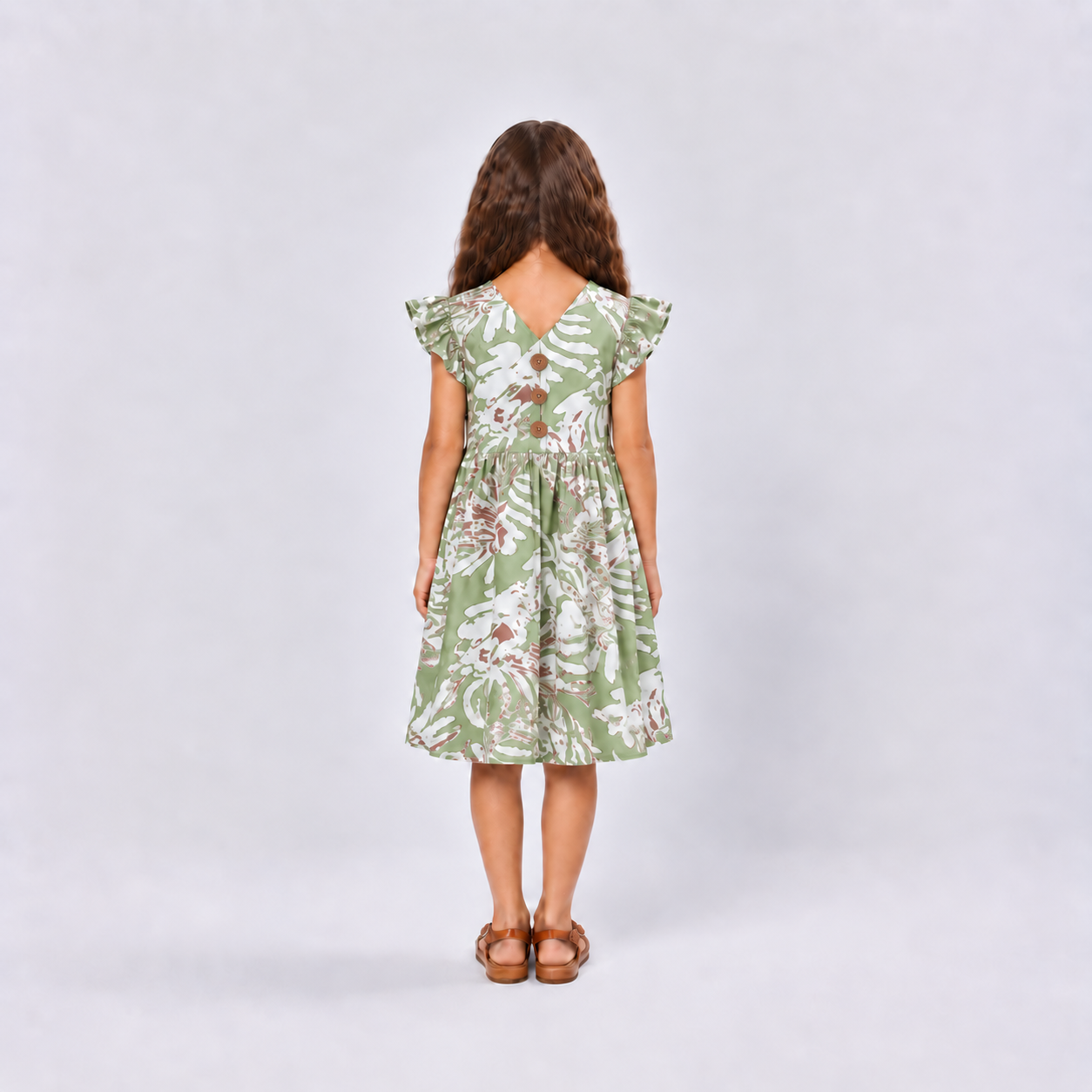 Girl wearing green dress facing the back