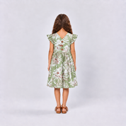 Girl wearing green dress facing the back