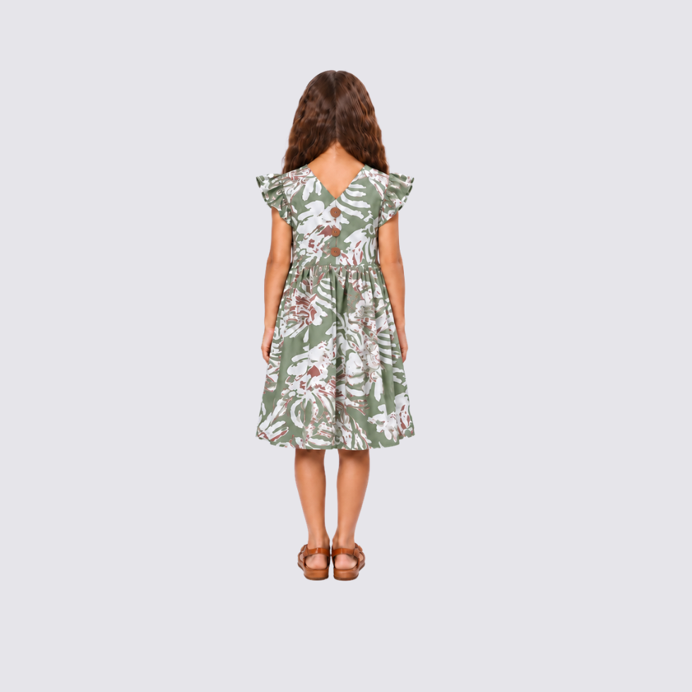 Girl facing back wearing green batik dress