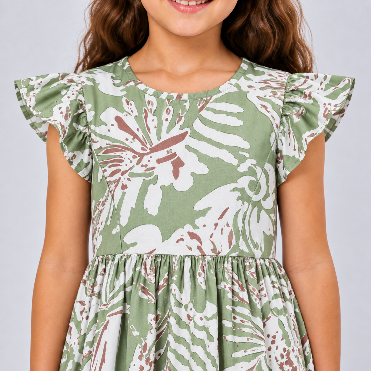 Girl wearing a green dress showing close up