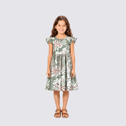 Girl facing front wearing green batik dress