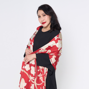 a woman against a white background in ruby fleur scarf 