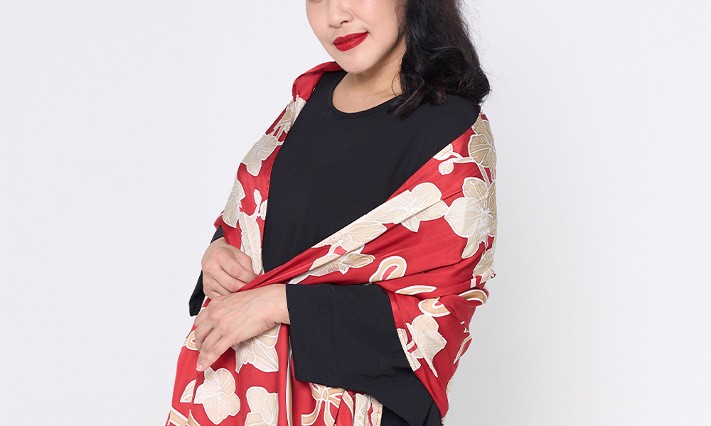 a woman against a white background in ruby fleur scarf 
