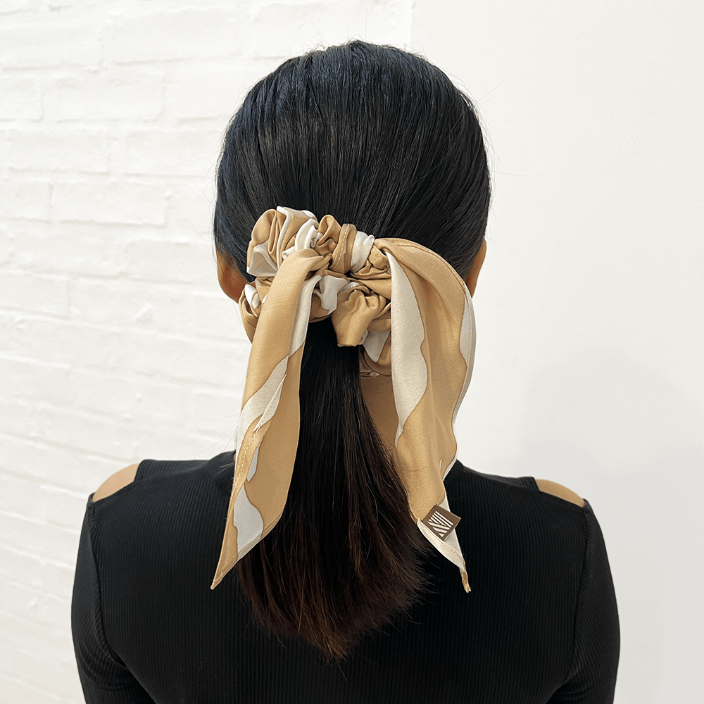 Batik boutique Tan rimba Scrunchie shown being worn by a women 