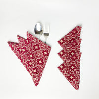 A whiebox of serviette set in crimson celestial complete with fork and spoon 