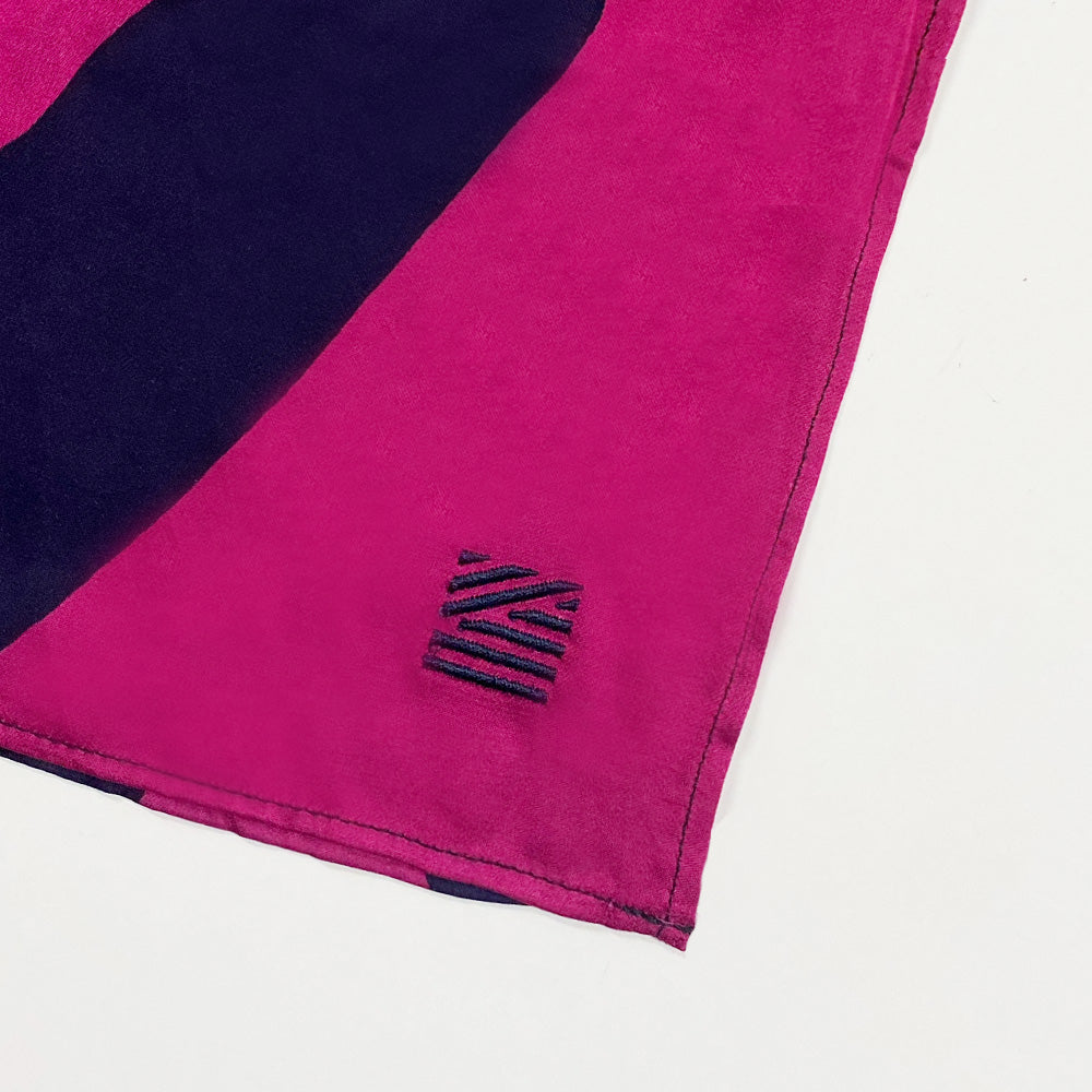 a whitebox close up photo of batik scarf in pink and navy blue color 