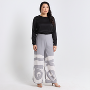 Woman wearing a black top and gray patterned pants on a white background
SilverRoseTrouser