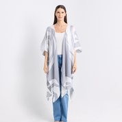 Woman wearing a light gray kimono-style garment with geometric patterns on a white background.
SilverRose_Kimono-front