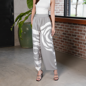 Women wearing silver rose wide leg trousers showing the versatile loose fit  