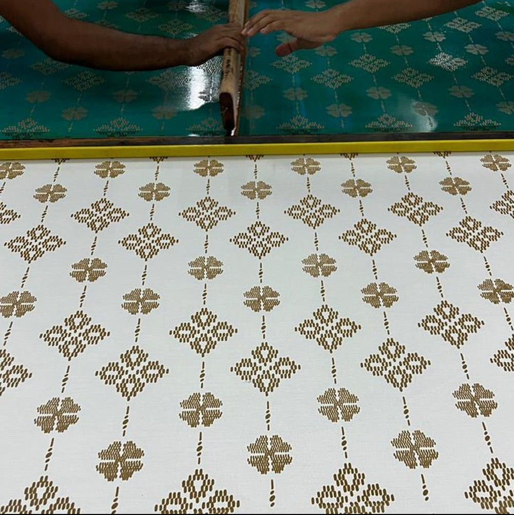 Artisan photo of the songket pattern being created 
