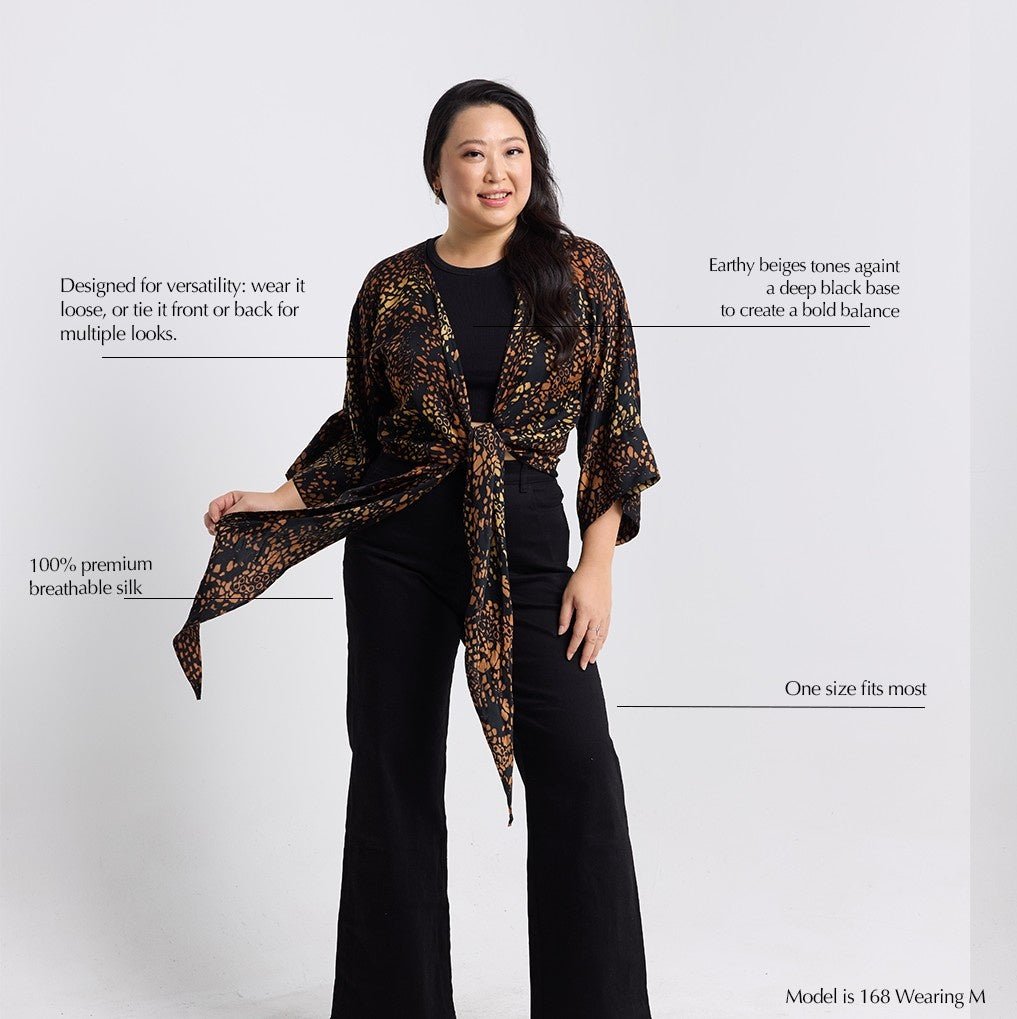 Woman wearing a patterned scarf with text on a white background