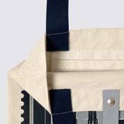 Closeup of totebag with gray-ish KL inspired prints