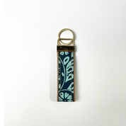 a key fob sewed in authentic batik against a white background in the pattern teal ukir