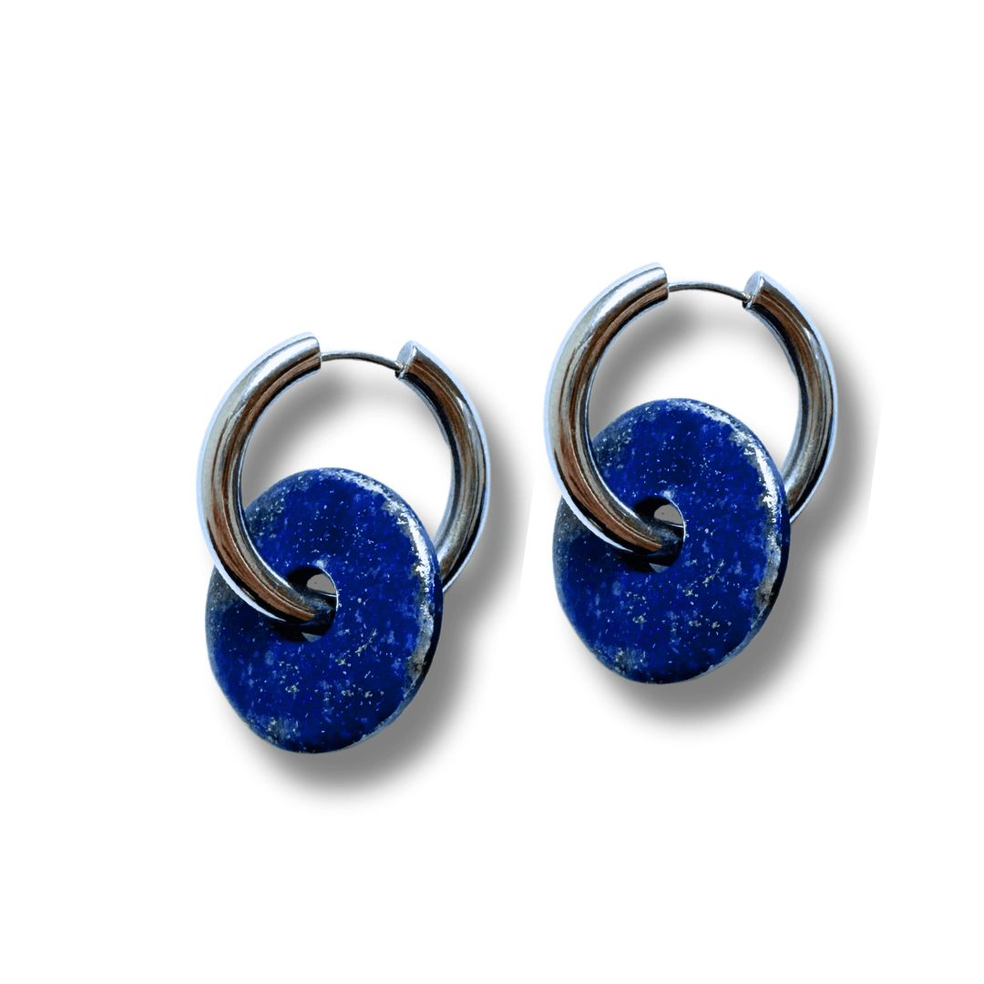 blue earrings with silver hoop against a neutral background handmade by refugees