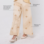 Beige pants with diamond patterns on a white background