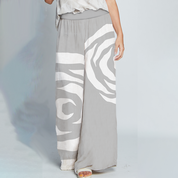 Detailed view of Silver Rose Batik wide leg trousers highlighting design features — flat front, side seam pockets, breathable fabric, and relaxed cut inspired by Malaysia’s batik heritage.