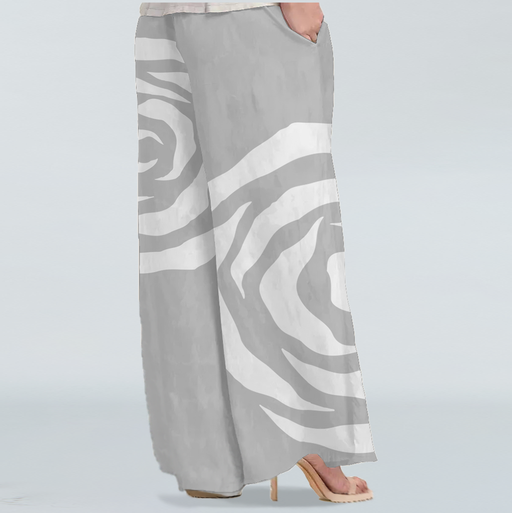 Back view of the wide leg Silver Rose Trousers. Comfy and flowy for a versatile look whether your getting ready for a meeting or going for a lunch . Showcasing the pockets in 