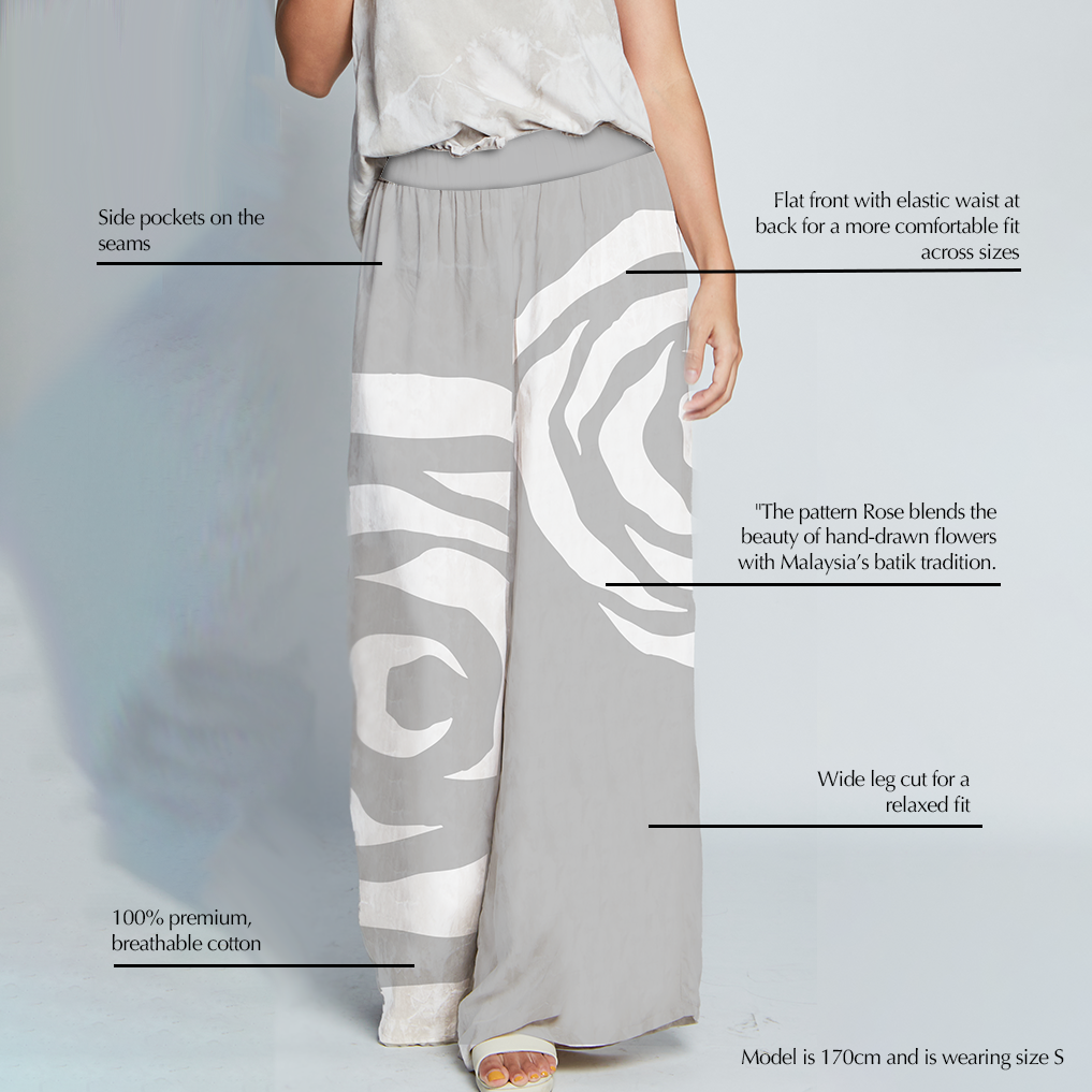 Detailed view of Silver Rose Batik wide leg trousers highlighting design features — flat front, side seam pockets, breathable fabric, and relaxed cut inspired by Malaysia’s batik heritage.