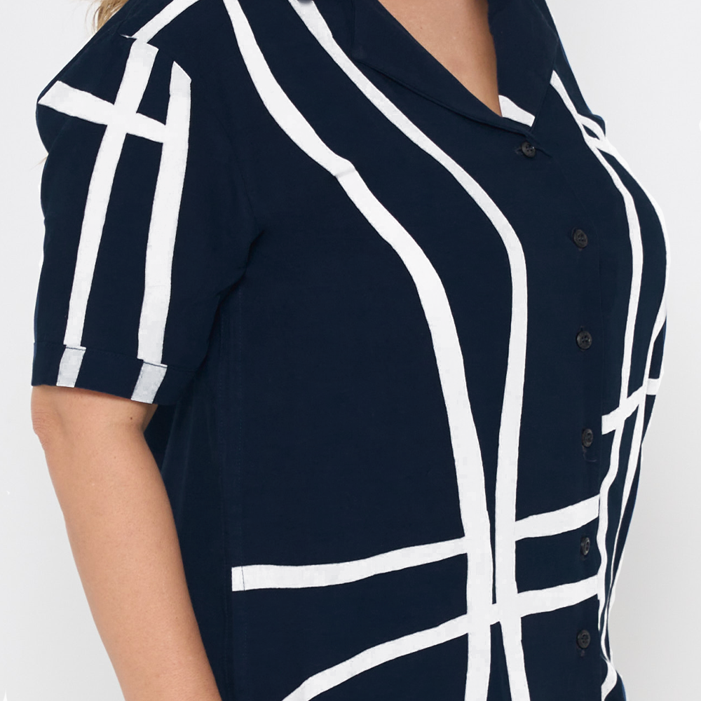 a closeup of a batik women cuban in the pattern navy brush against a white background