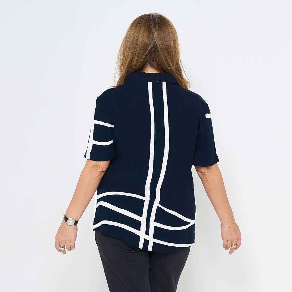 the back of a batik cuban for women against a white background in the pattern navy brush