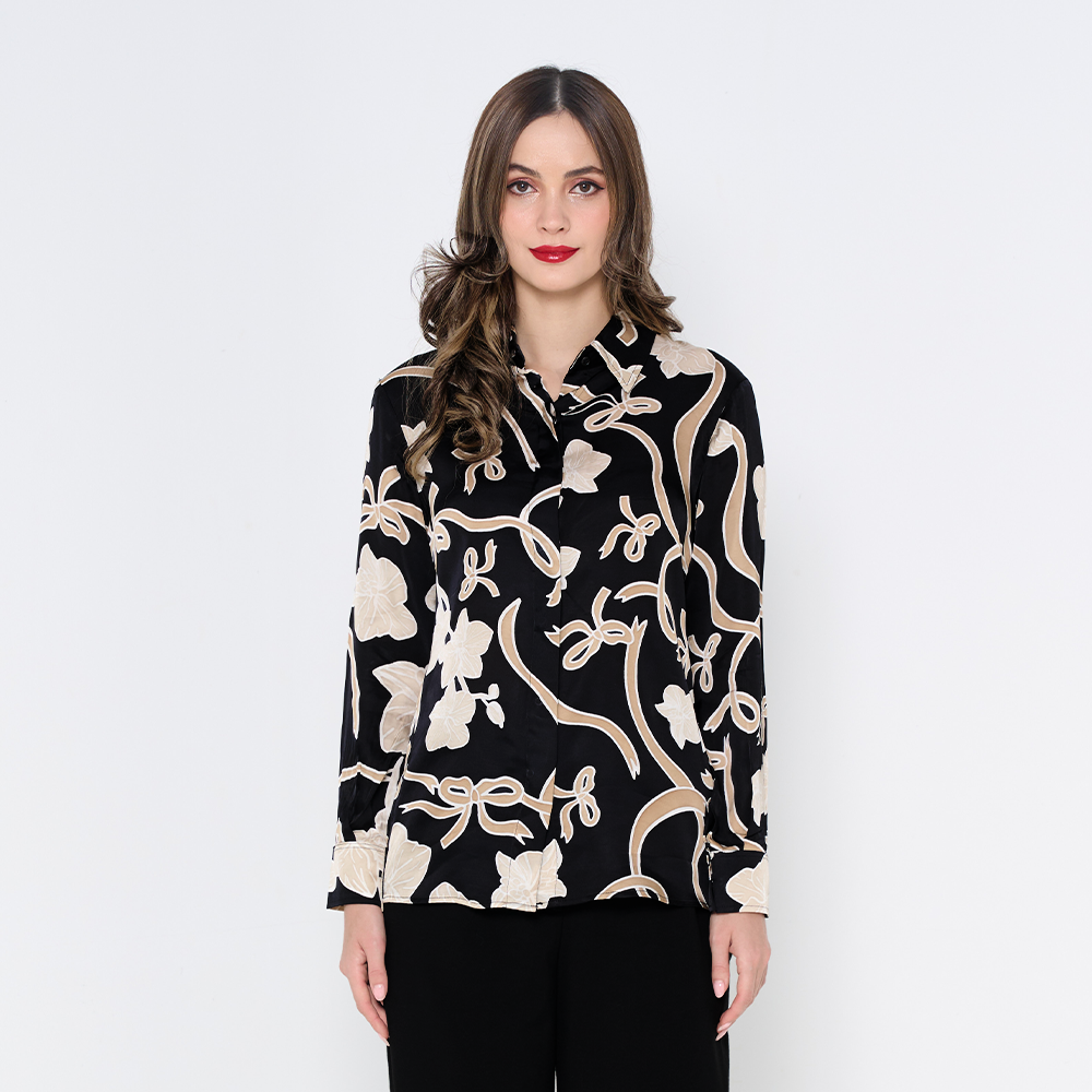 a woman in batik long sleeved shirt in the pattern onyx fleur