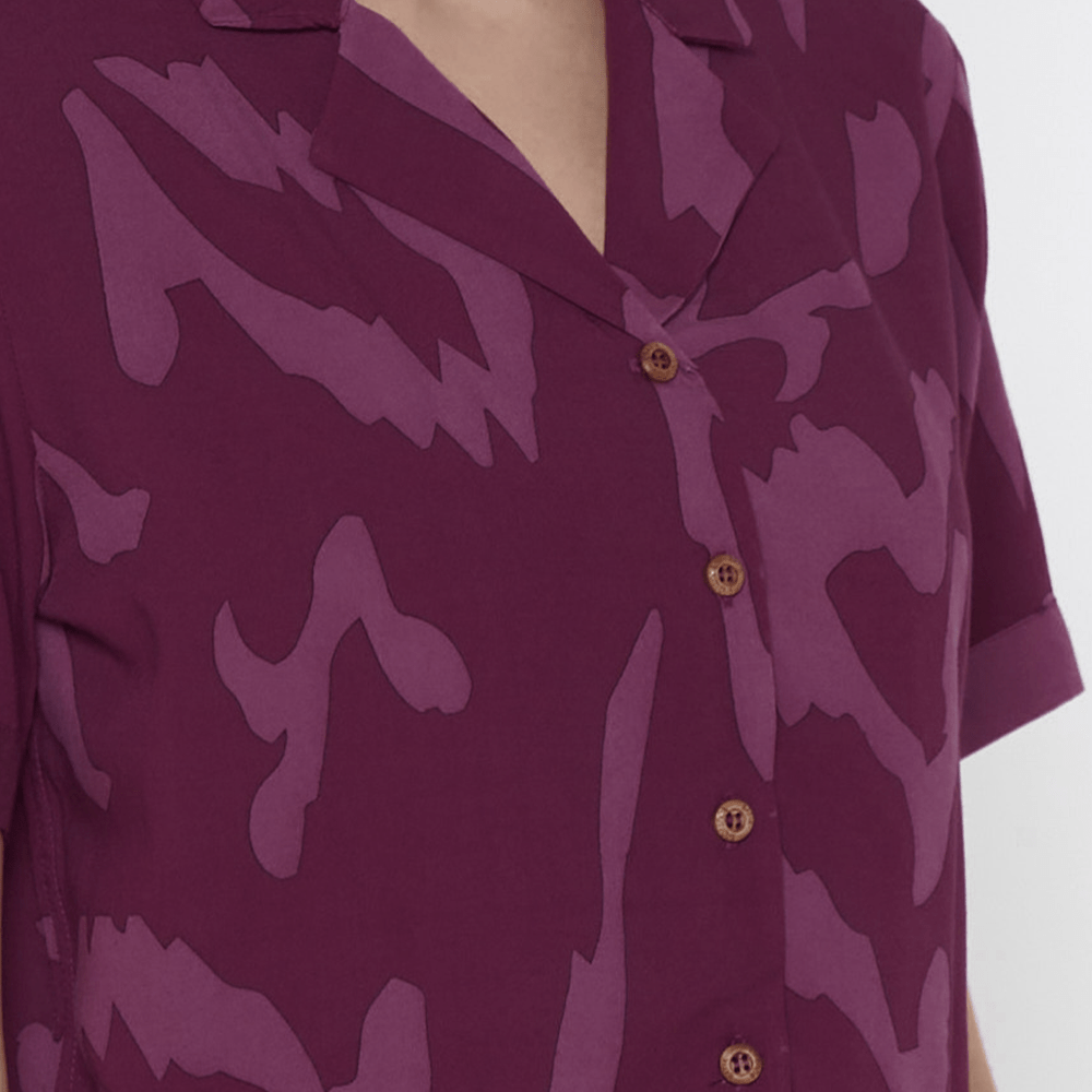 a closeup of batik shirt in cuban cutting in the pattern plum rimba