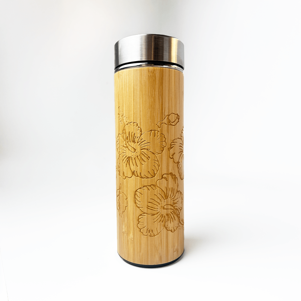 Bamboo tumbler with floral embossing on a white background