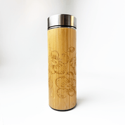 Bamboo tumbler with floral embossing on a white background