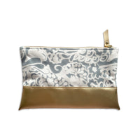 a white box photo of batik zip pouch in grey peony pattern on back side