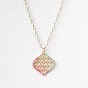 Necklace with a geometric pendant on a white background
